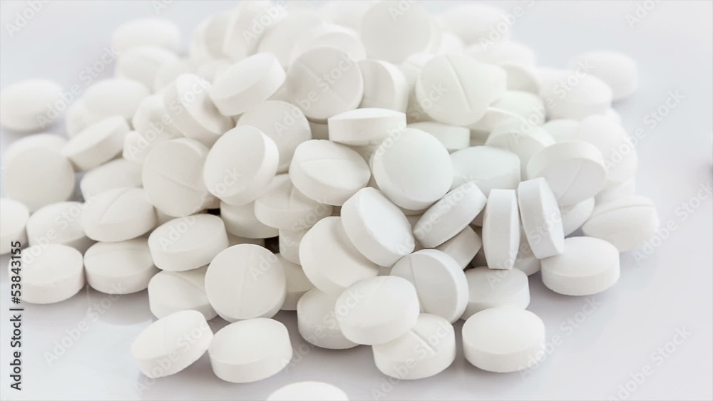 Medical pills placed on rotating table, shot with white seamless Medical pills placed on rotating table, shot with white seamless