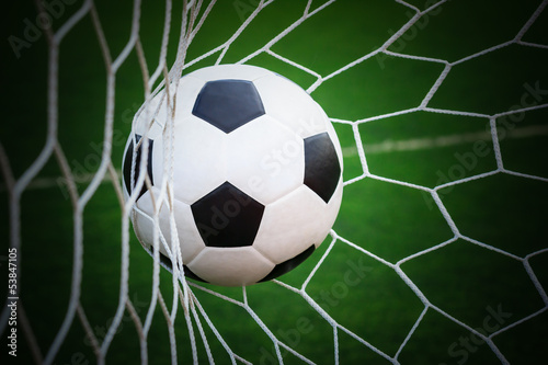 football in goal net © tungphoto