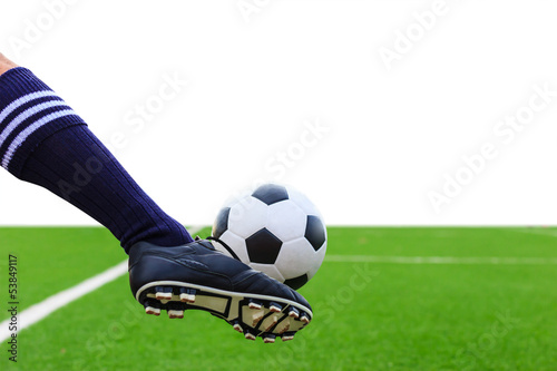 foot kicking soccer ball isolated with clipping path © tungphoto