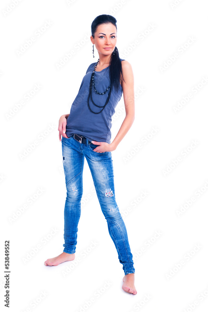 Isolated on white brunette woman standing in jeans Isolated on white brunette woman standing in jeans