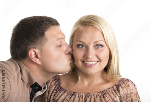 Couple kissing on white background