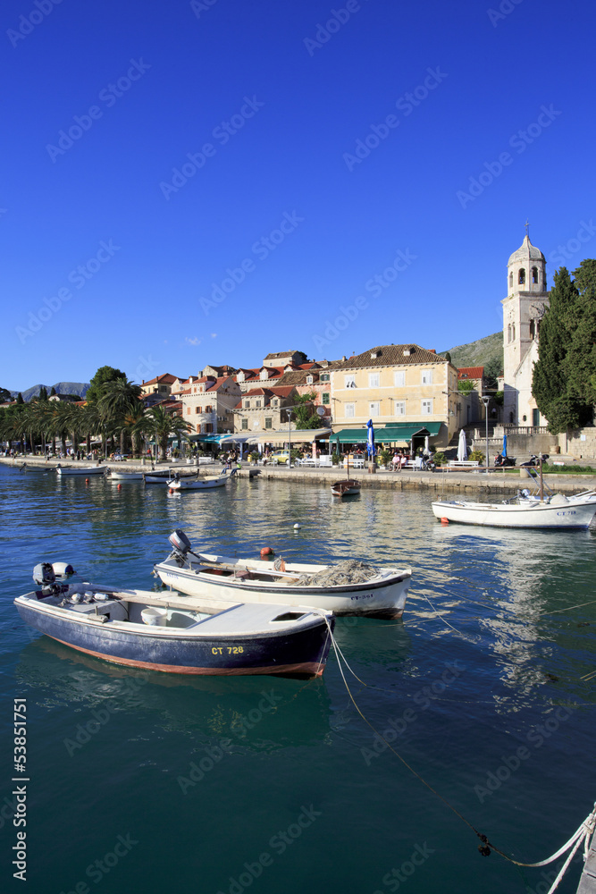 Cavtat shoreline with fishing boats and church