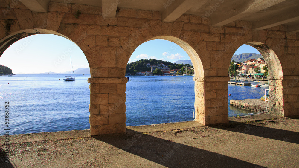 View of Cavtat shoreline through arches