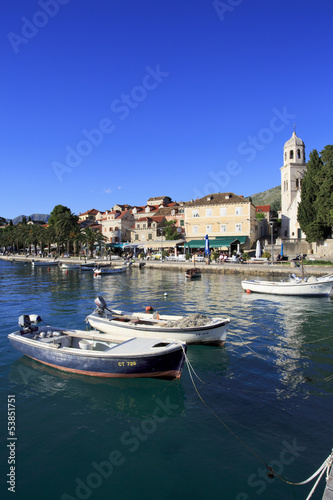 Cavtat shoreline with fishing boats and church