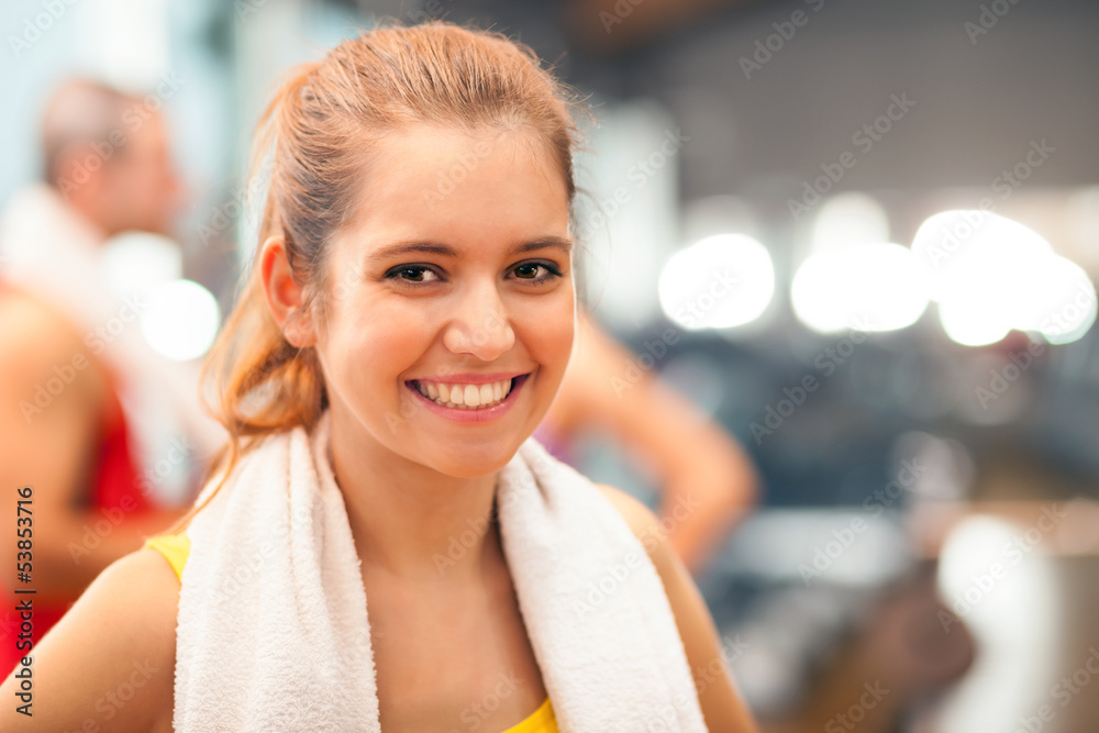 Girl smiling in a fitness club