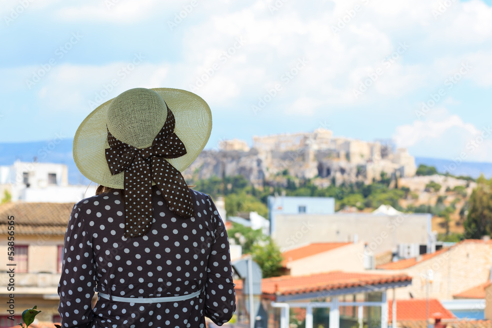 young woman looking at Acropolis