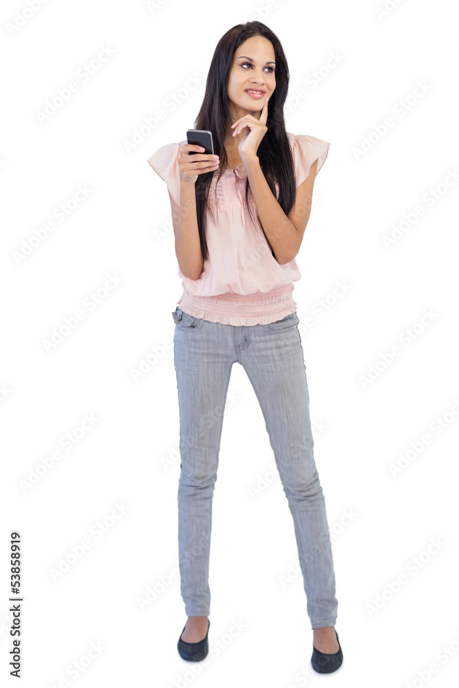 Woman thinking about text message Woman thinking about text message