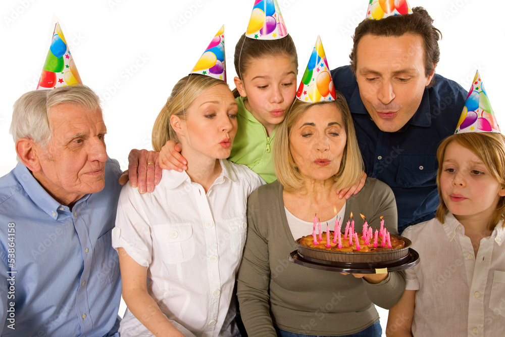 family celebrating birthday party with cake family celebrating birthday party with cake
