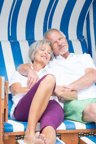 Senior couple in beach chair photo