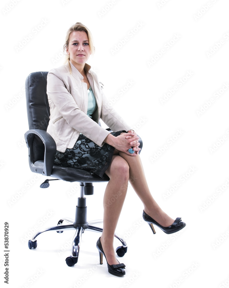 Successful business woman sitting on desk chair Successful business woman sitting on desk chair