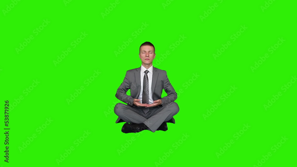 Young businessman meditating, Green Screen Young businessman meditating, Green Screen