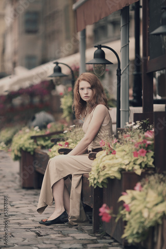 beautiful woman resting on the streets of the beautiful city