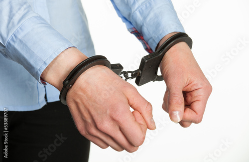 Hands in handcuffs © zest_marina