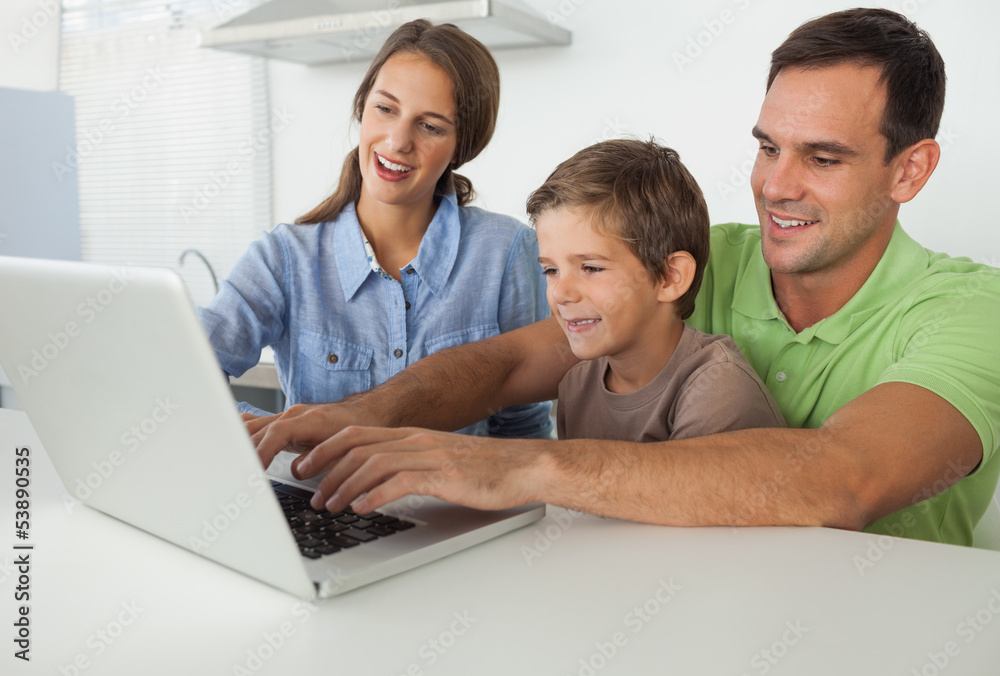 Father and son using a laptop Father and son using a laptop