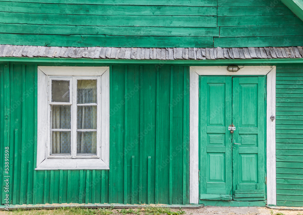 Detail of a traditional green wooden house in Trakai