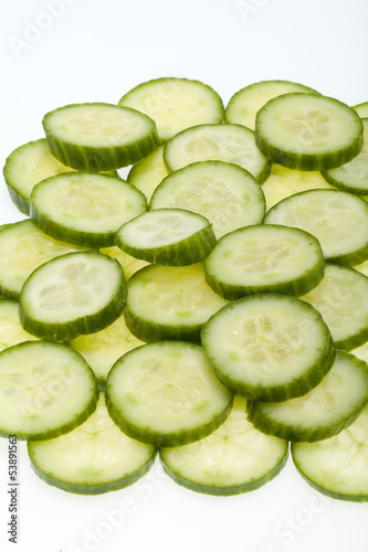 Freshly sliced cucumber  isolated on white background