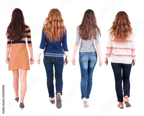 Back view of walking group of woman
