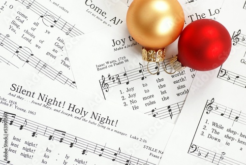 Music notes with Christmas carol and Christmas ornaments photo