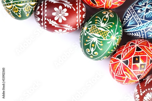 Top view of Easter eggs frame on white background