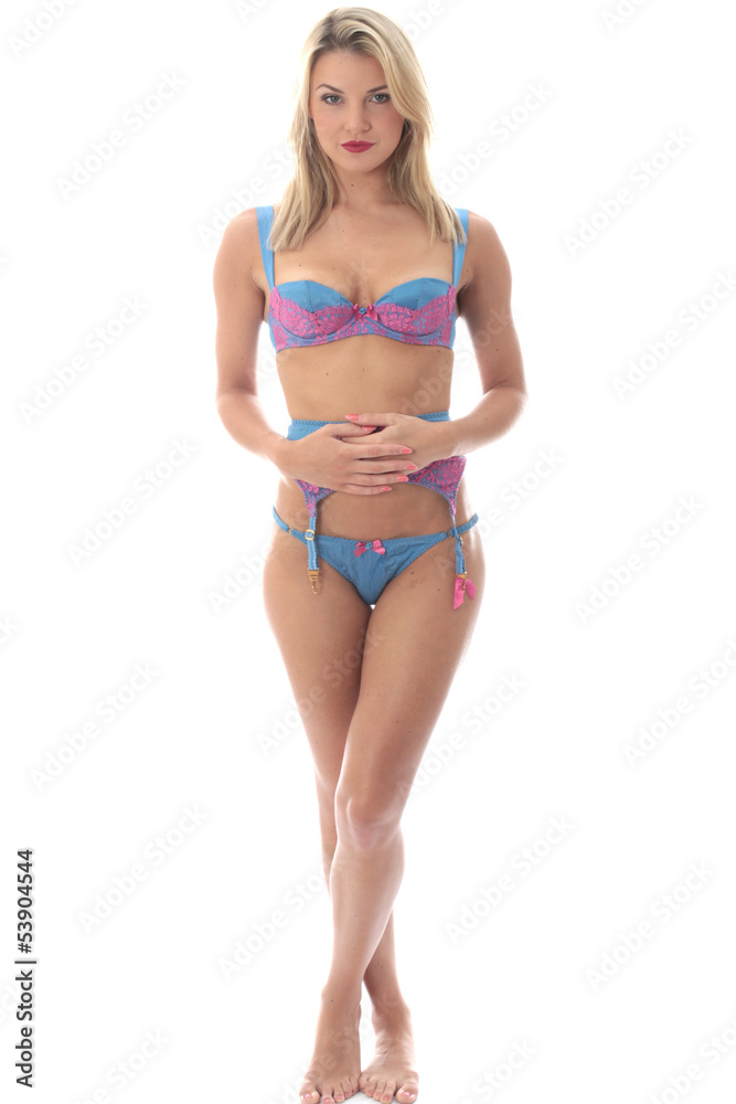 Fototapeta premium Attractive Young Blonde Caucasian Woman, Posing in Sexy Lingerie Wearing Sexy Panties, Bra And Suspender Belt 