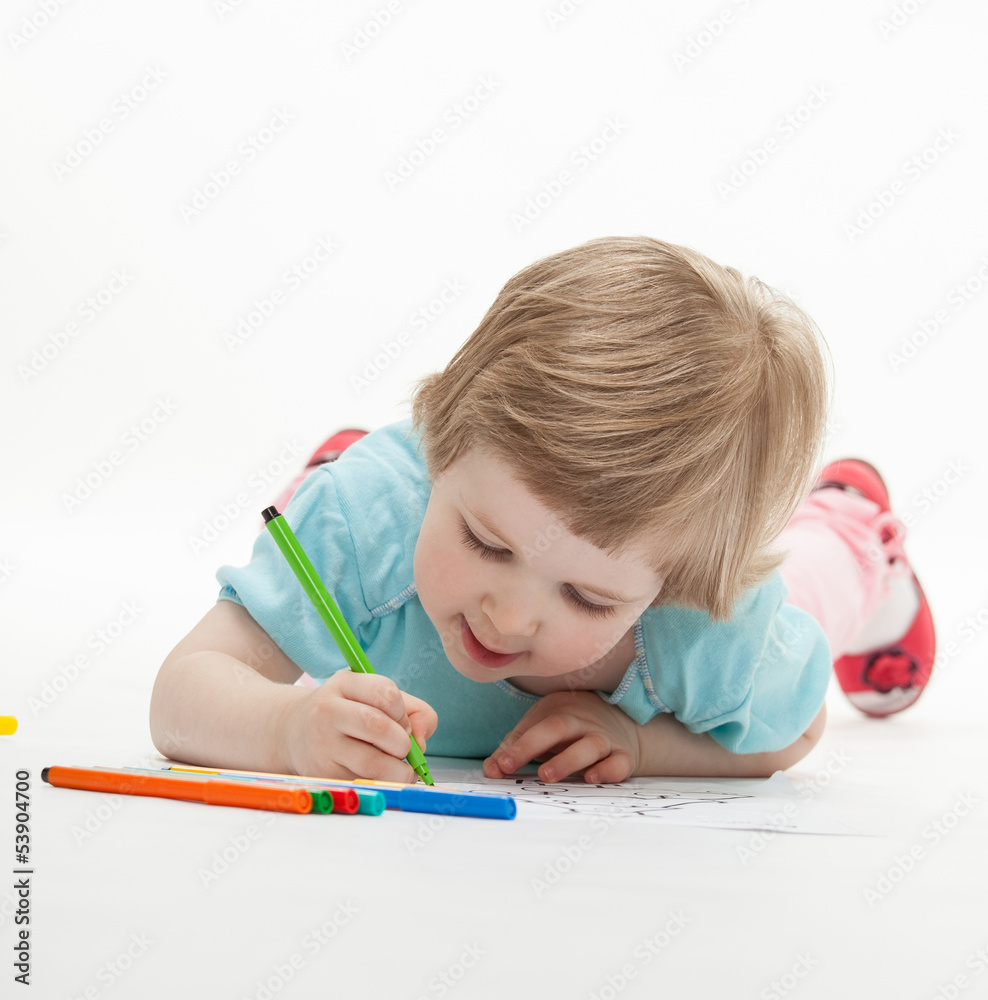Child drawing a picture with colorful felt-tip pens Child drawing a picture with colorful felt-tip pens