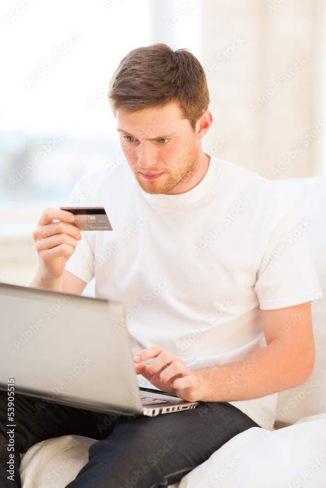 man with laptop and credit card at home man with laptop and credit card at home