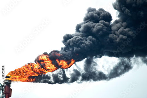 Heavy smoke from industrial chimney polluting the environment .