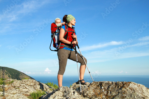 baby carrier in alps, on sunny day