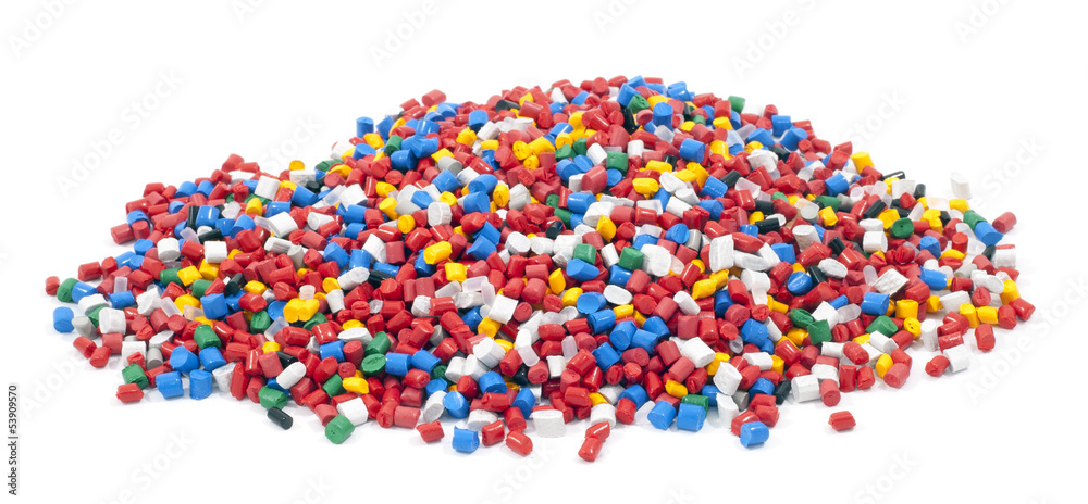 colorful plastic polymer granules on white background