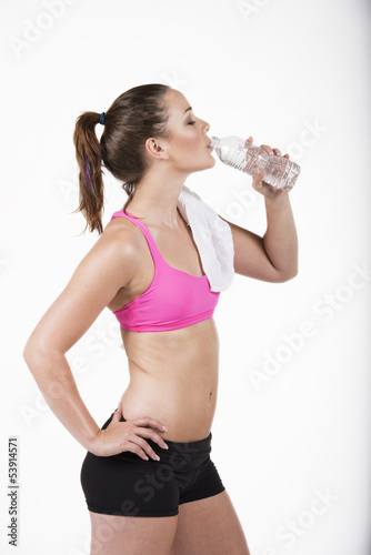 A beautiful young woman drinking water