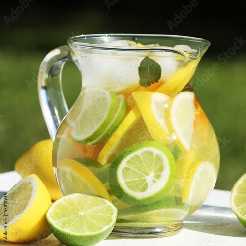 jug with fresh lemonade outdoor in summer day