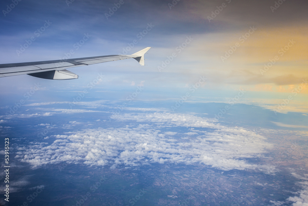 View from airplane on top of cloud
