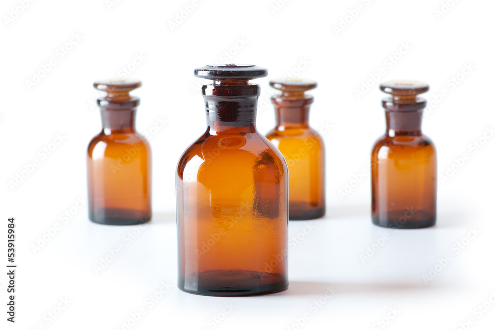 Small chemical glass bottles on white background Small chemical glass bottles on white background