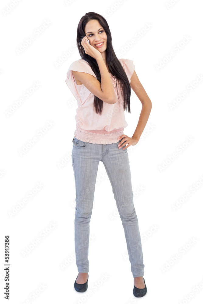 Smiling woman calling someone with her mobile phone Smiling woman calling someone with her mobile phone
