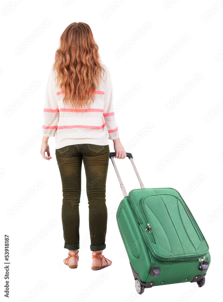 back view of walking woman with suitcase. back view of walking woman with suitcase.