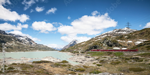 Passo del Bernina Svizzera - Lago Bianco con treno rosso photo