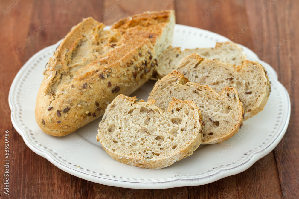 bread with cereals on white plate