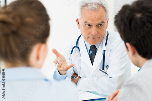 Doctor discussing with patients