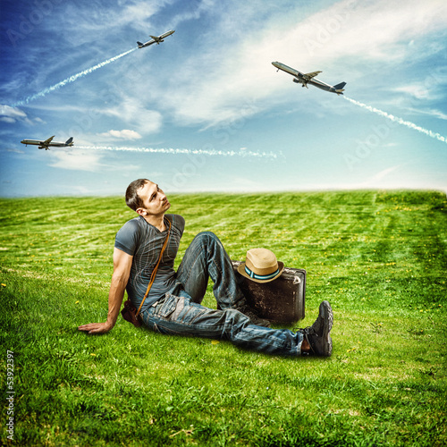 Young man traveler and flying airplanes © katalinks