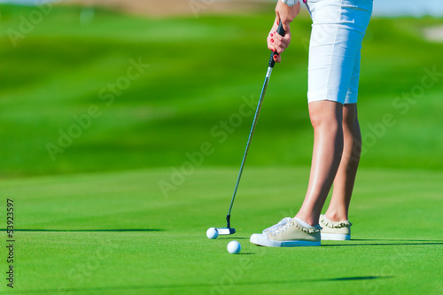 Woman playing golf