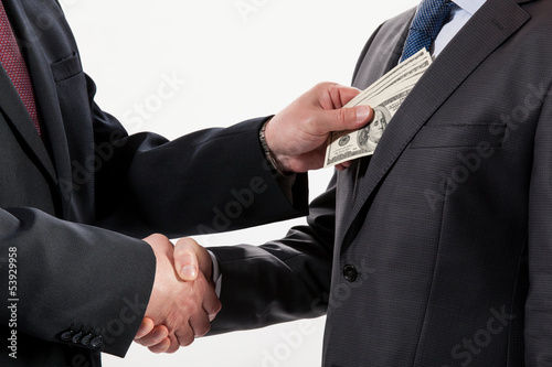 Giving a bribe into a pocket photo