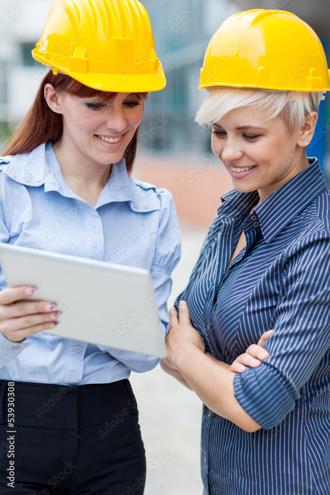 Female constructors are discussing their project Female constructors are discussing their project