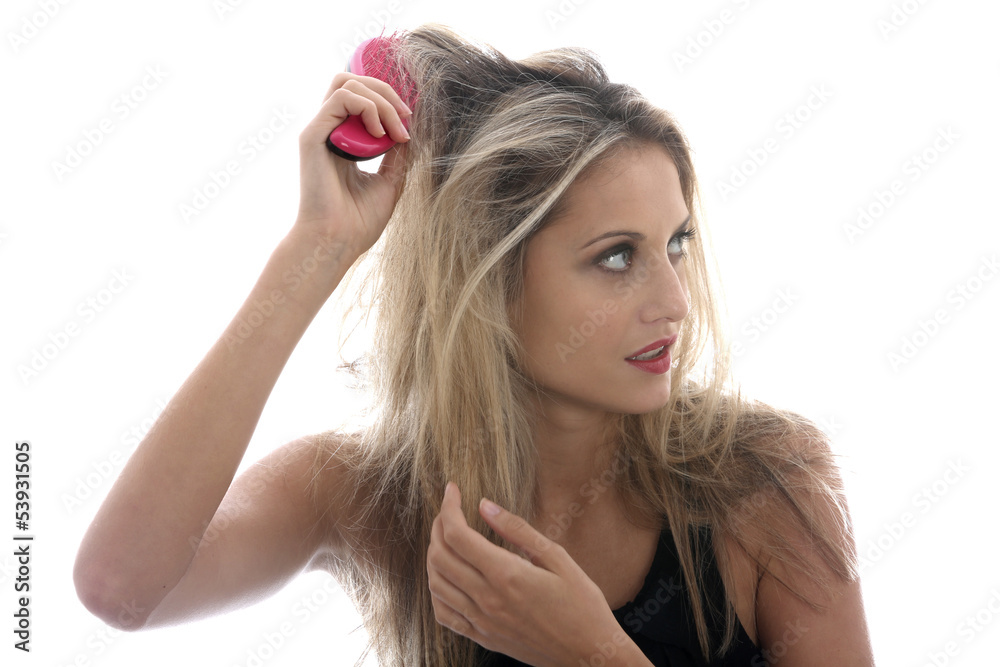Obraz premium Model Released. Young Woman Brushing Tangled Hair