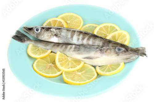 Fresh fish with lemon on plate isolated on white