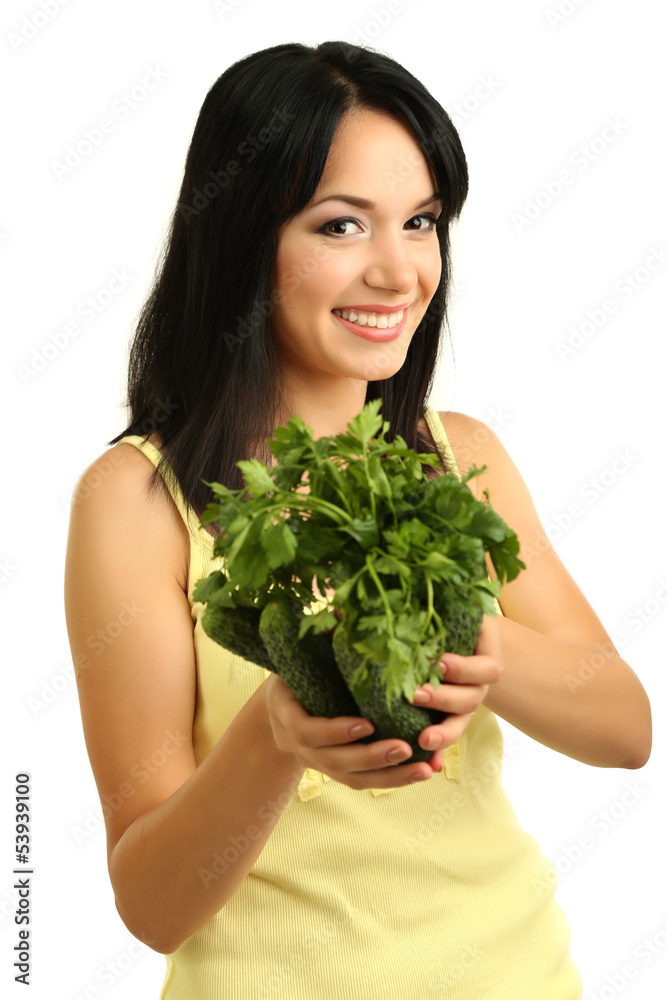 Girl with fresh cucumbers and greens isolated on white Girl with fresh cucumbers and greens isolated on white
