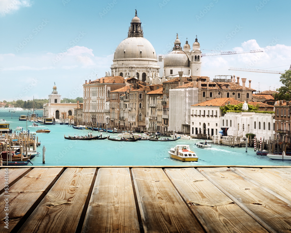 Fototapeta premium Basilica Santa Maria della Salute, Venice, Italy and wooden surf