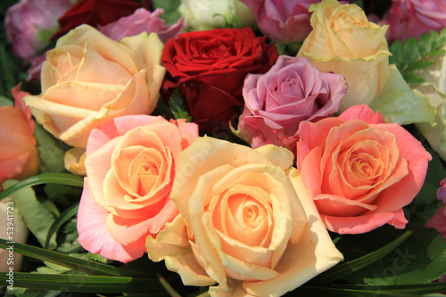 Pastel roses in bridal arrangement