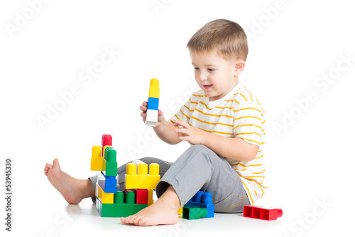 kid boy playing with block ...