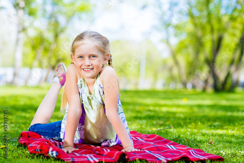 portrait of a smiling girl in a park © adam121