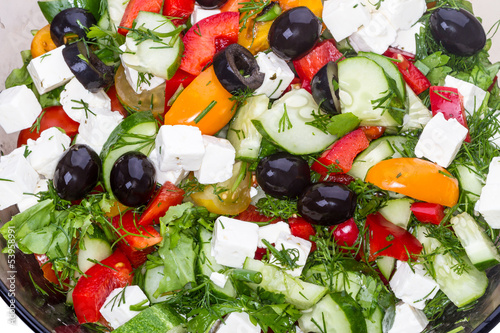 Vegetable salad with olives and mozzarella